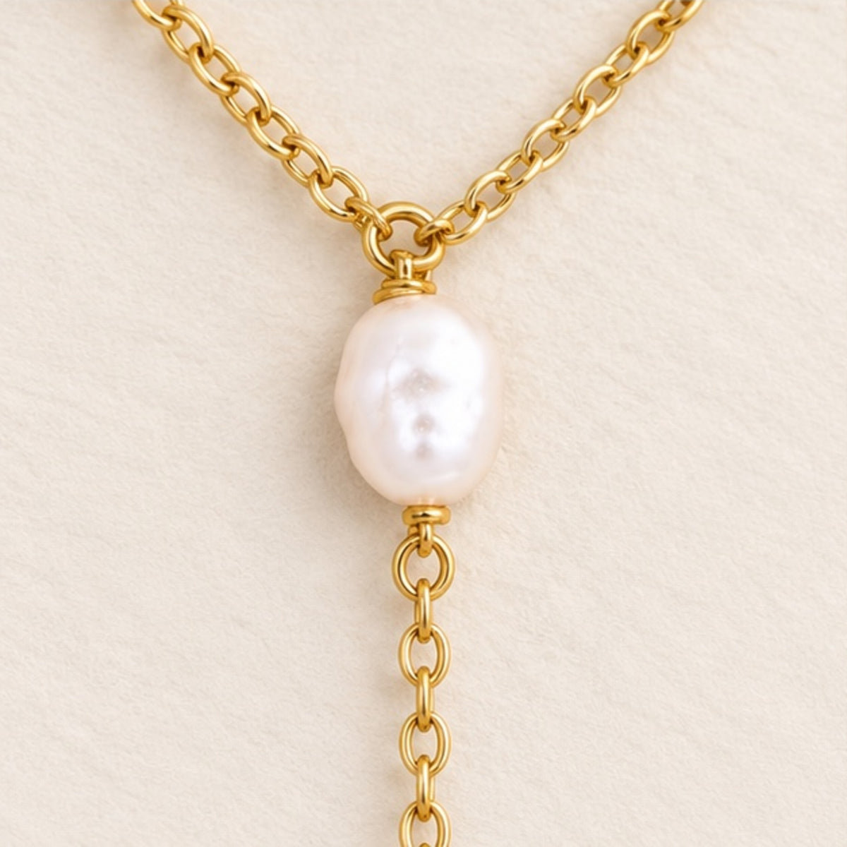 Pearl lariat necklace in 18k gold filled, close up of the Y junction where the drop chain begins