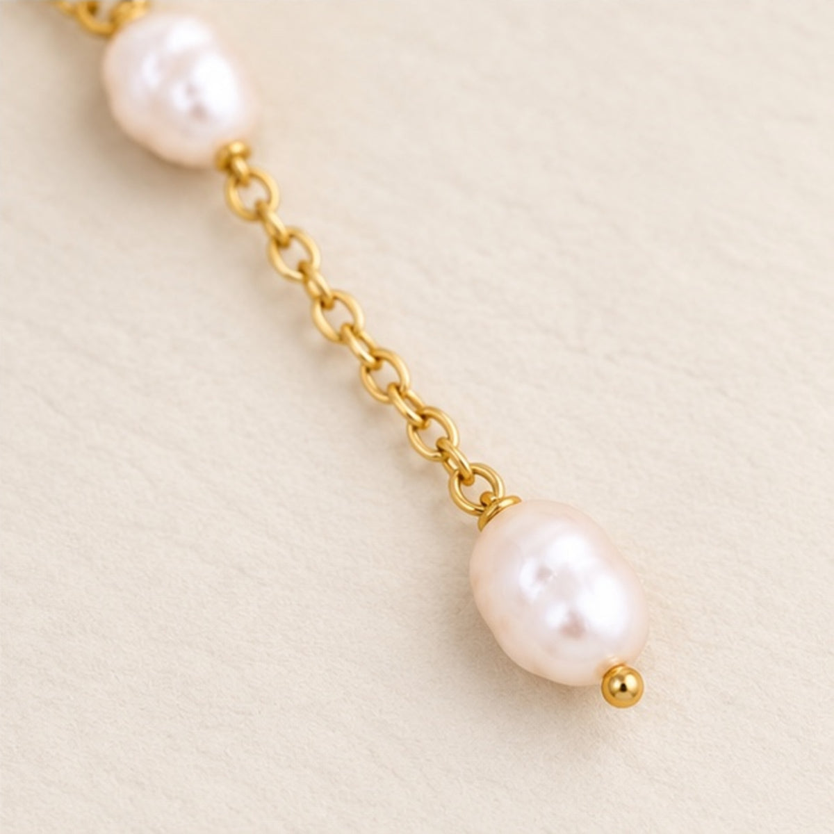 Pearl lariat necklace in 18k gold filled, close up of the drop with the second pearl and gold bead finish